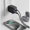 Interlink Aura 25W dual port wall charger plugged into a wall outlet charging a smartphone and wireless earbuds simultaneously